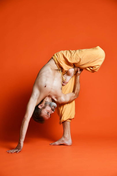 Man practicing advanced yoga. A series of yoga poses. - Foto, afbeelding