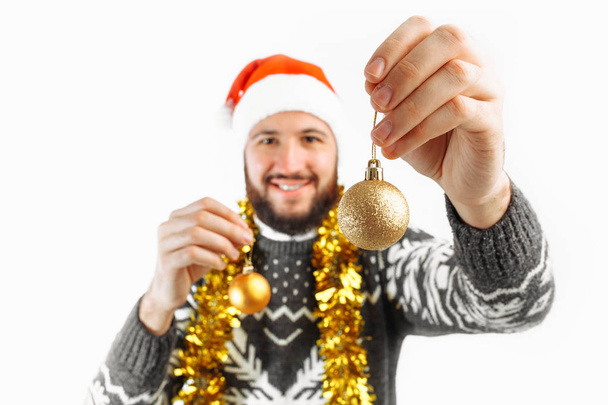 man with Christmas balls, with Christmas decorations - Φωτογραφία, εικόνα