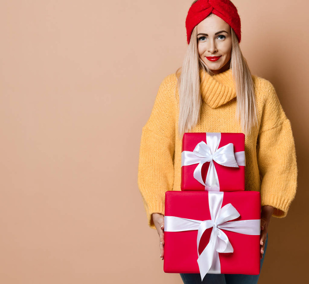 Beautiful woman hold red Christmas or birthday presents gift boxes for new year celebration  - Fotografie, Obrázek