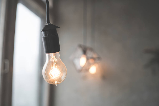 Lamps with tungsten filament. Edison light bulb. Filament filament in vintage lamps. Retro design of light bulbs.  - Foto, imagen