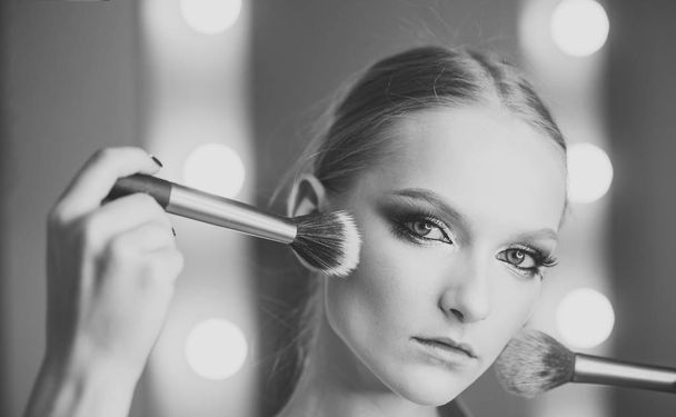 Visage model with makeup brushes. Visage course for glamour makeup. - Фото, зображення