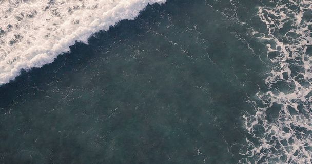 Aerial view beautiful of sea waves from drone. Stock image of blue color of ocean water, sea surface. Top view on turquoise waves, clear water surface texture.  Top view, amazing nature background - Zdjęcie, obraz