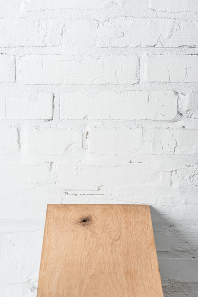textured wooden board and white brick wall - Foto, Imagen