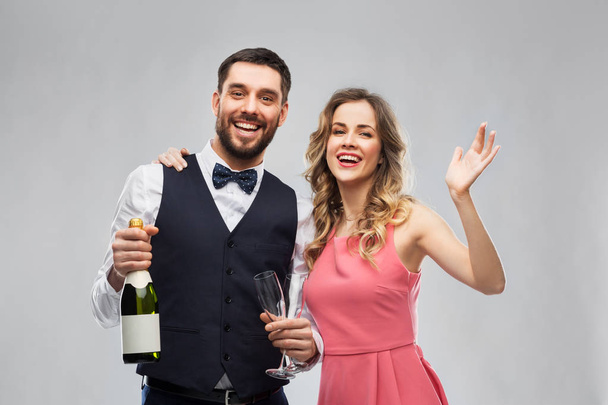 happy couple with bottle of champagne and glasses - Photo, Image