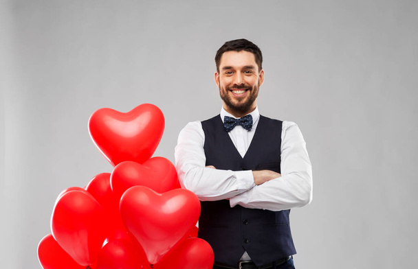 happy man with red heart shaped balloons - Foto, imagen