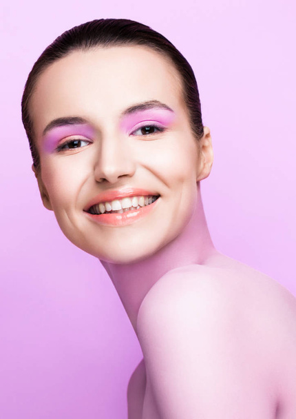 Beautyl girl natural makeup spa skin care on purple violet background with cute smile - Foto, Imagem