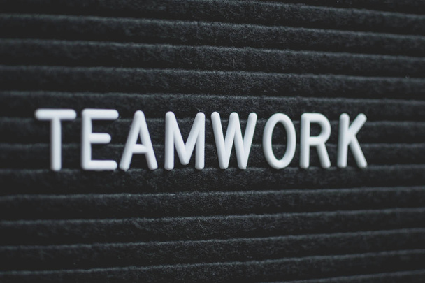 Word teamwork written on the letter board. White letters on the black background. Business concept - Photo, Image