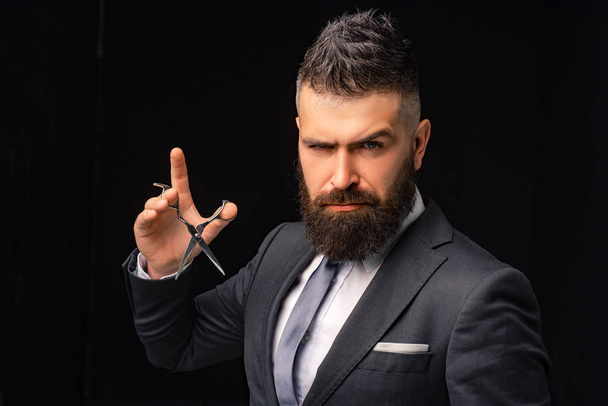 Barbershop. Hair salon and barber vintage. Barber on black background with copy space. Beard care. Haircuts for men. Hairstyle for men. Bearded men with hair scissors. - 写真・画像