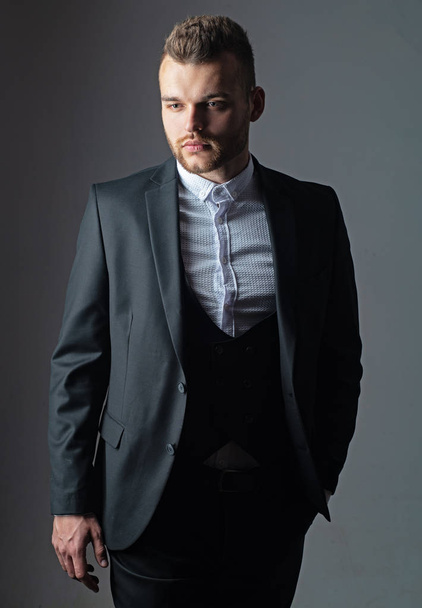 Business style. Confident and successful. Handsome young man in a business suit. Elegant handsome business man isolated on black. Closeup bearded businessman wearing stylish mens suit. - Foto, Bild