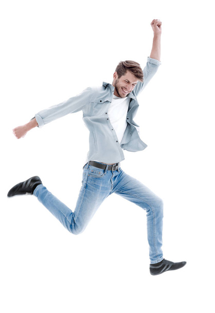 Happy man jumping in air over white background - Fotoğraf, Görsel