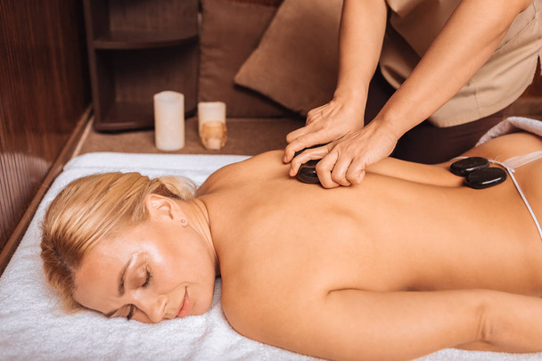 Joyful relaxed woman visiting a massage salon - Φωτογραφία, εικόνα