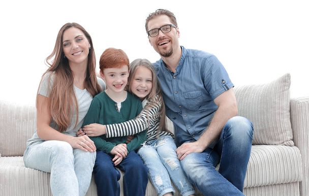famiglia con due bambini seduti sul divano in soggiorno
 - Foto, immagini