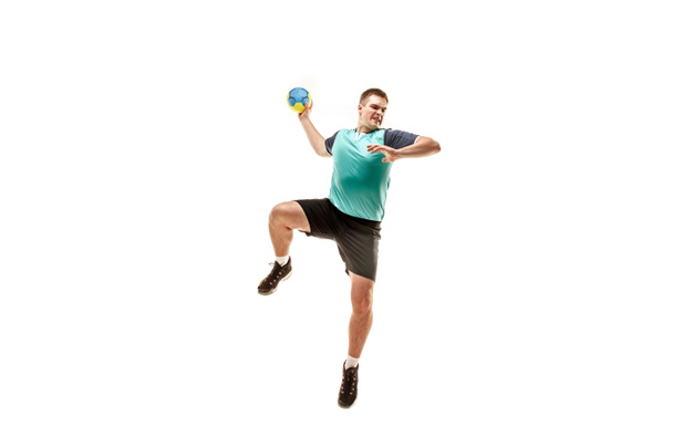 The one caucasian young man as handball player at studio on white background - Foto, afbeelding