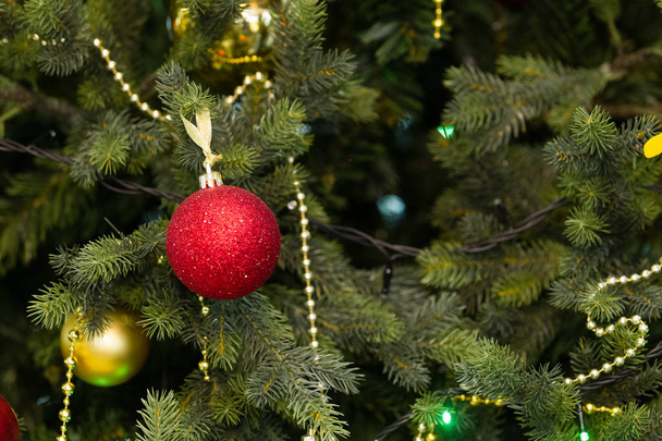 New Year. Celebration. Toys hang on the Christmas tree, background - Zdjęcie, obraz