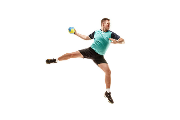 The one caucasian young man as handball player at studio on white background - 写真・画像