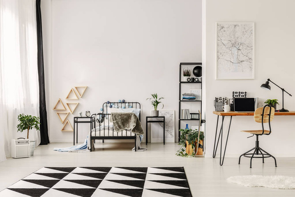 Black and white interior design of spacious kid's bedroom with workspace - Fotó, kép