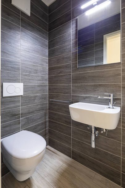 Bathroom with elegant minimalist brown tiles. Nobody inside - Fotó, kép