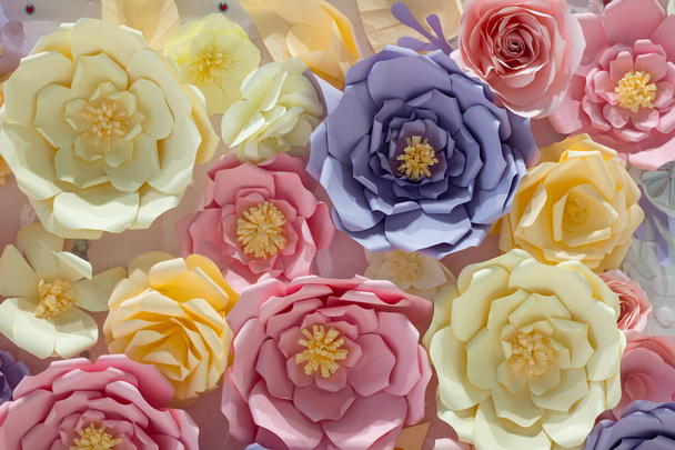 Multicolored pink yellow blue wedding floral background of paper flowers - Photo, Image