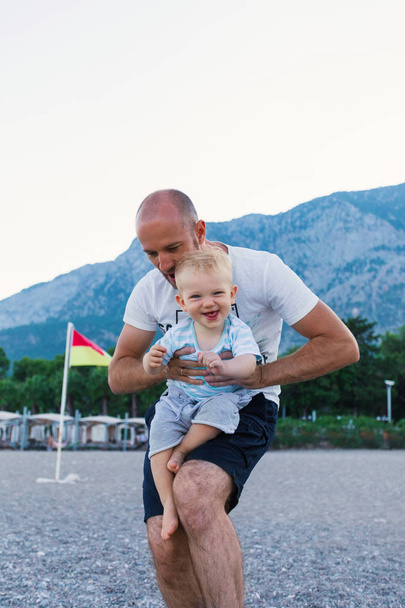 Dad and son having fun outdoors. - 写真・画像