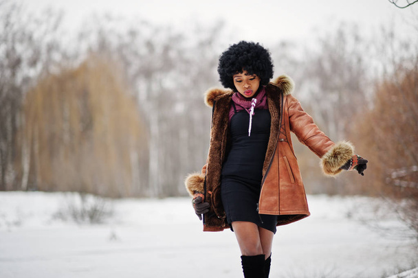 Curly hair african american woman wear on sheepskin coat and gloves posed at winter day. - Fotografie, Obrázek