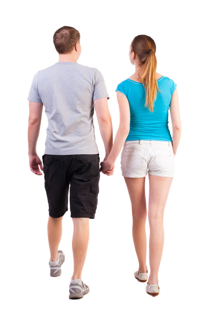 Back view of going young couple - Foto, Imagen