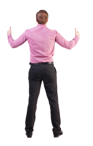 Back view of business man shows thumbs up. - Foto, imagen