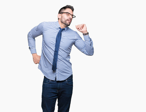 Young business man wearing glasses over isolated background stretching back, tired and relaxed, sleepy and yawning for early morning - Fotoğraf, Görsel