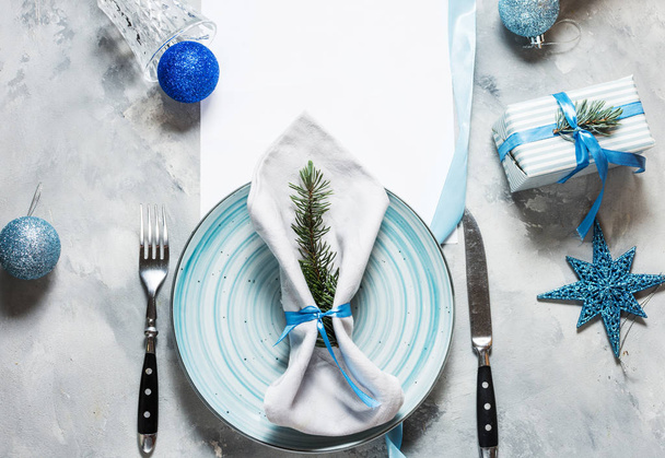 Beautiful Christmas table setting with decorations. Preparation for christmas dinner. Top view and copy space - Foto, immagini