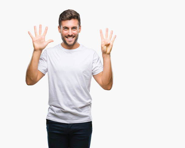 Young handsome man over isolated background showing and pointing up with fingers number nine while smiling confident and happy. - Photo, Image