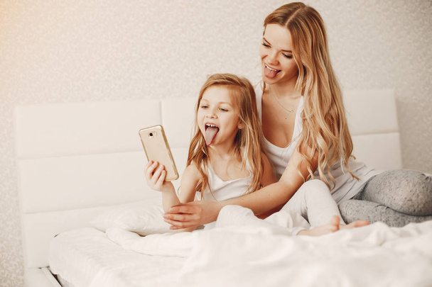 mother with cute blond daughter - Photo, image