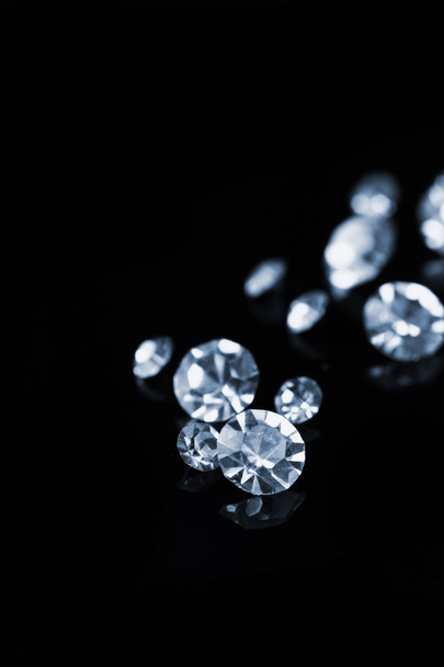 Beautiful shining crystals (diamonds), on black background - 写真・画像