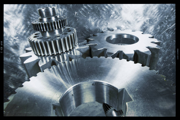 titanium gears and cogs machinery, used in the aerospace industry, photo-transparancy black border, can be cropped away if need be - Photo, Image