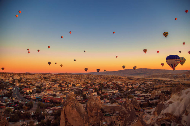 Central Anatolia, Goreme, Turkey - September 22, 2018. Amazing sunrise over Cappadocia. Colorful hot air balloons.  - Φωτογραφία, εικόνα