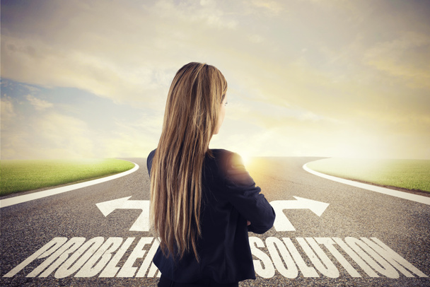 Businesswoman at a crossroads. She chooses the correct way. Concept of decision in business - Photo, Image