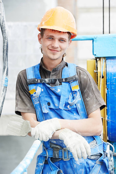 Facade worker portrait. builder at plastering work - Fotoğraf, Görsel