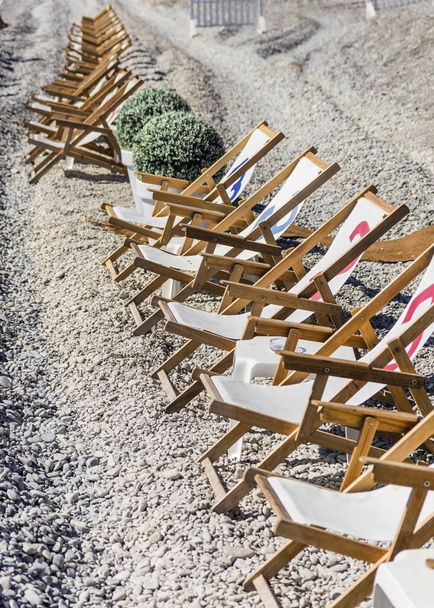 Deck chairs on a beach during spring - Photo, Image