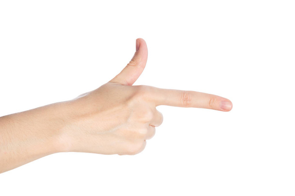 Wskazując gestem. Ręka pokazuje palcem wskazującym na białym tle izolat - Zdjęcie, obraz