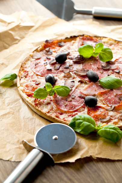 Tasty pizza on wooden table, top view - Foto, Bild