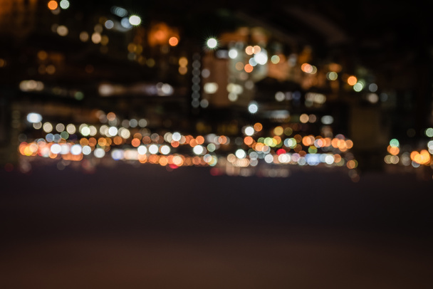 blurred buildings with bright bokeh lights at night  - Photo, Image