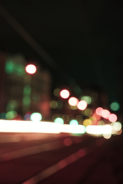 blurred street with bright bokeh lights at night - Foto, Imagem