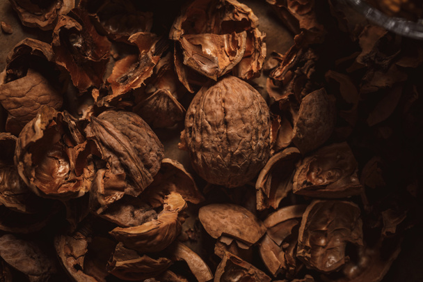 close up view of walnut husk as background - Foto, imagen