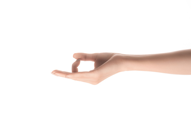 visión parcial del gesto de la mujer con mentón mudra aislado en blanco
 - Foto, imagen