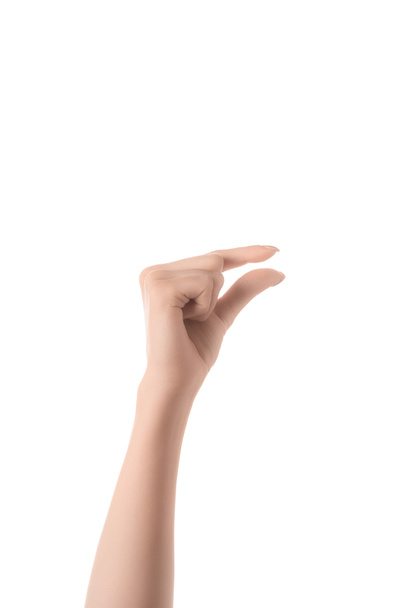 vista cortada da mulher mostrando gesto de tamanho com a mão isolada no branco
 - Foto, Imagem