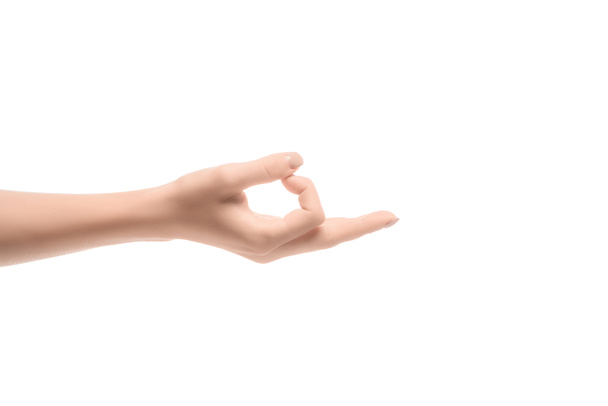 bijgesneden beeld van vrouw gebaren met kin mudra geïsoleerd op wit - Foto, afbeelding