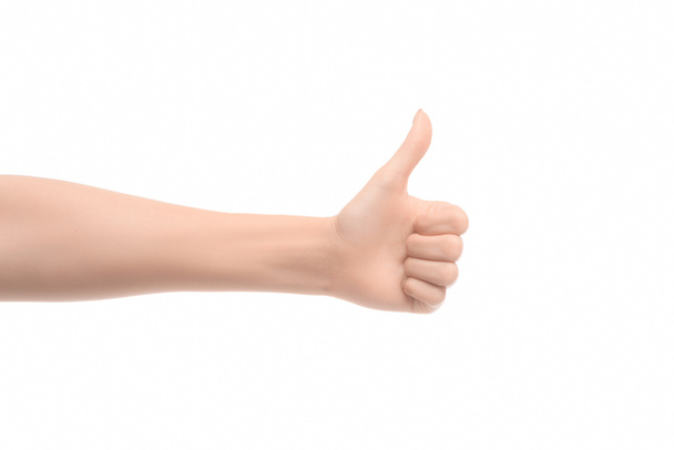 gedeeltelijke weergave van vrouw weergegeven: duim omhoog teken geïsoleerd op wit - Foto, afbeelding