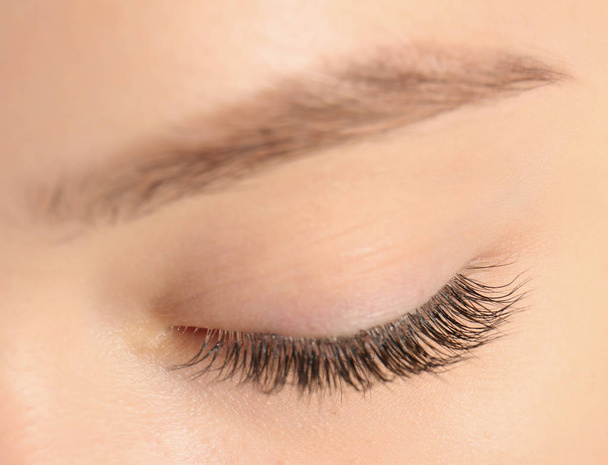 Closeup view of beautiful young woman with eyelash extensions - Foto, Imagen