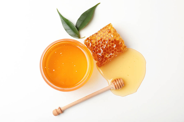 Composition with fresh honey on white background, top view - Fotografie, Obrázek