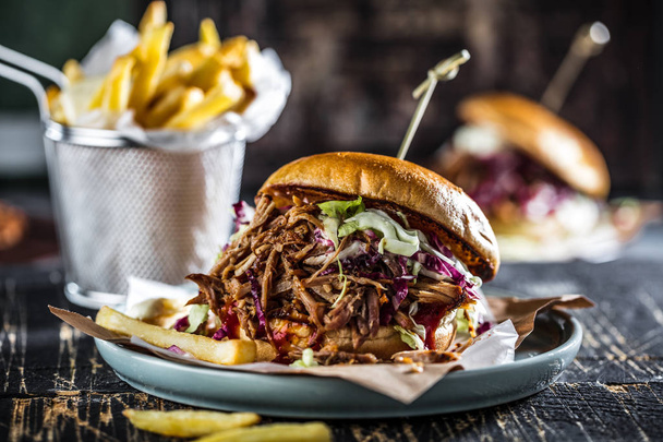 homemade pulled pork burger with bbq sauce close up - Foto, Imagen
