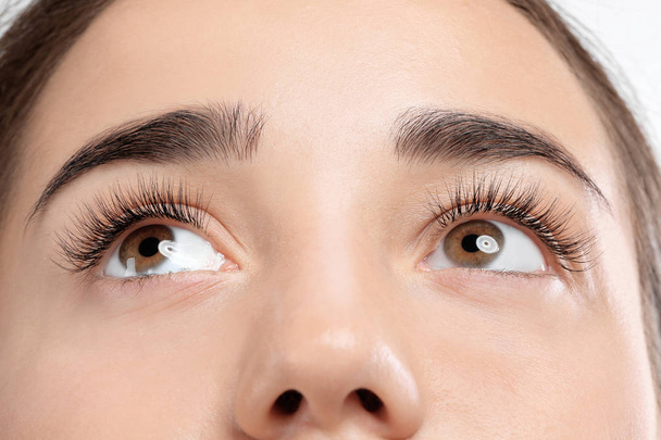 Young woman with beautiful eyelashes, closeup view - Foto, Imagem