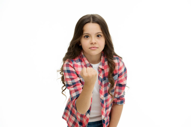 Threatening violence. Stop bullying movement. Girl kid threatening with fist. Strong personality temper. Threaten with physical attack. Kids aggression concept. Aggressive girl threatening to beat - Foto, Imagen
